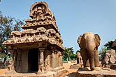 Mamallapuram - Tamil Nadu. The five Rathas. The Nakula Sahdeva Ratha with elephant carved  from a single stone stands next to it. 
